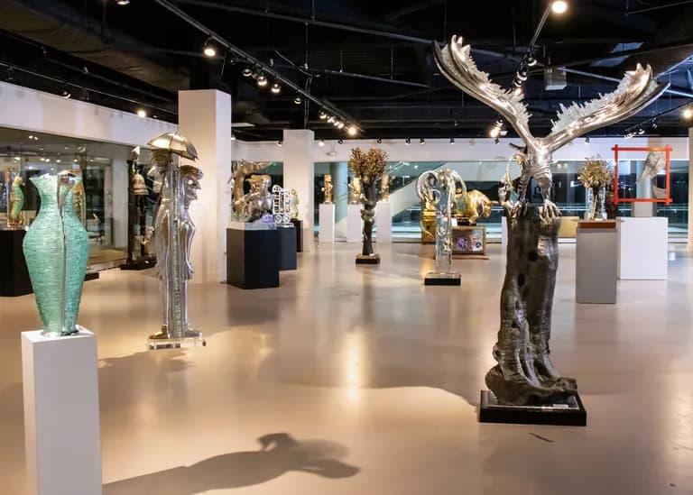 Sculptures by Apostol on plinths in a gallery interior