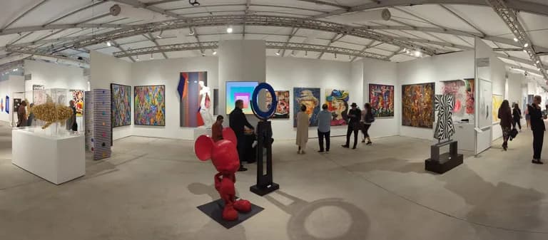 Daniele Fortuna's carved wooden heads shown at the Art Miami art fair