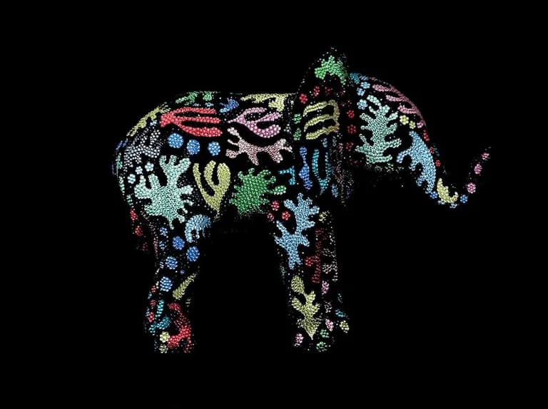 An elephant by Metis Atash encrusted with crystals in green and pink