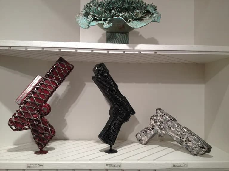 Daniel Fiorda, Gun Series, painted metal forms on a shelf