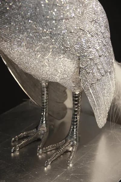 The legs and body of a crystal encrusted bird by Clarita Brinkerhoff, in detail