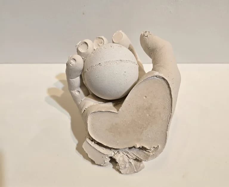 Paul Joseph White, a cast concrete hand and foot