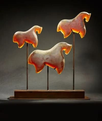 Marlene Rose, Amber Rose Carousel, 2012, sandcast glass and metal, 36 by 34 by 8 inches