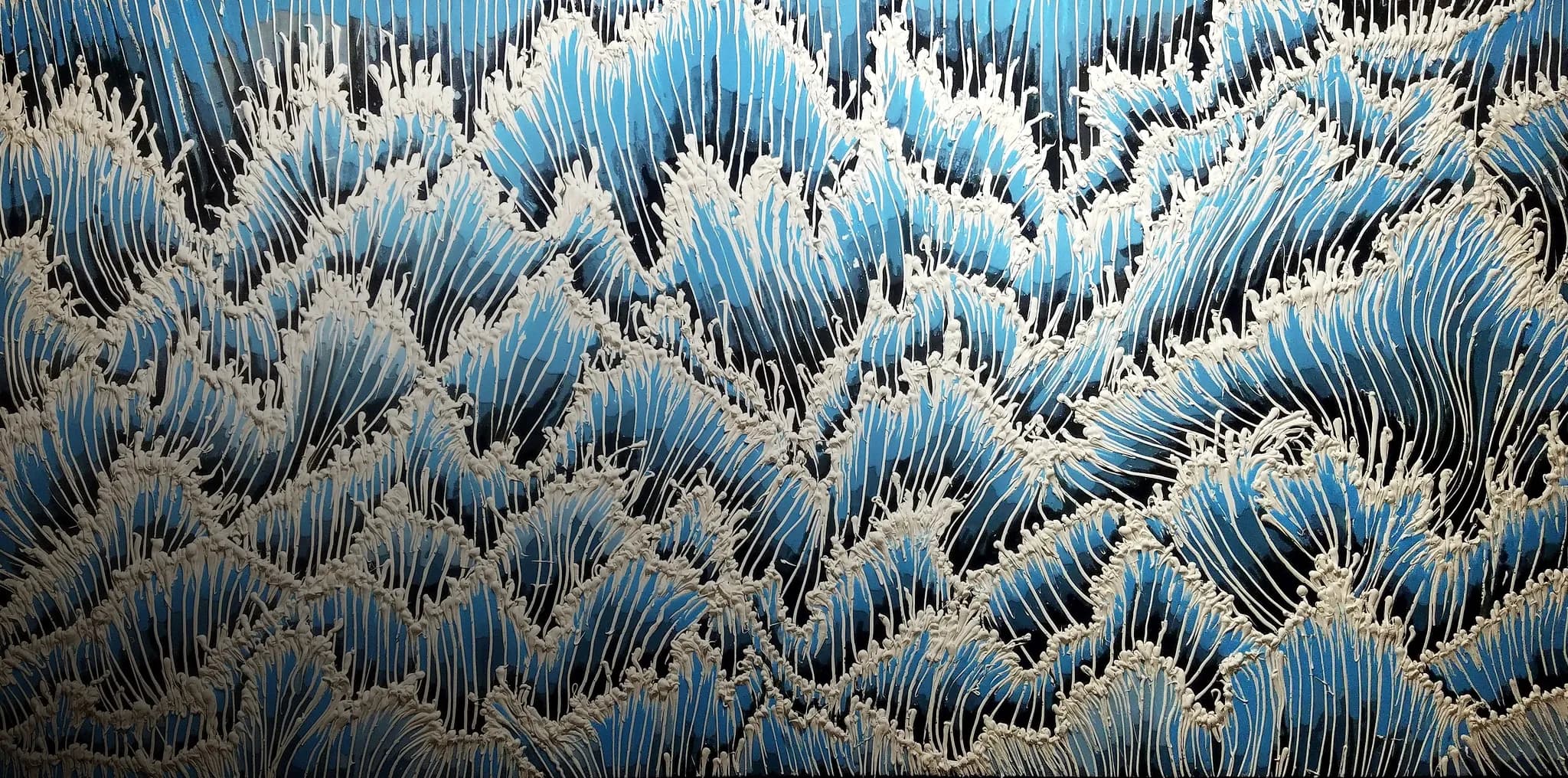 Enrique Machado, Blue Chaos, 2017: rows of breaking peaks in blue resin strings capped with white silicone foam.
