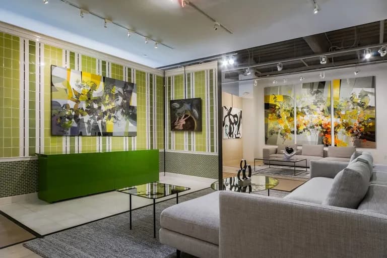 Large paintings by Ramon Chirinos hung in an interior