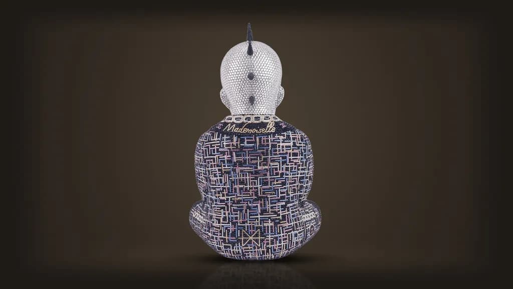 Metis Atash, Mademoiselle Chanel, from the back: the word Mademoiselle in gold script across the collar of a crystal tweed jacket